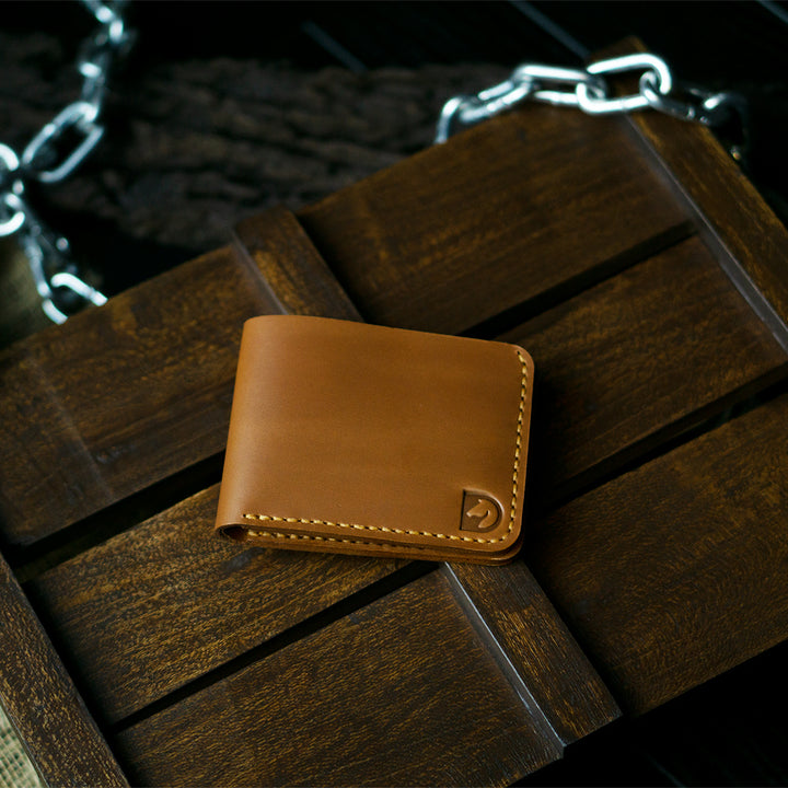 Handmade bifold wallet hand stitched with vegtan leather