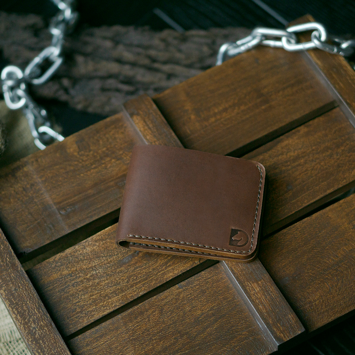 Handmade bifold wallet hand stitched with vegtan leather