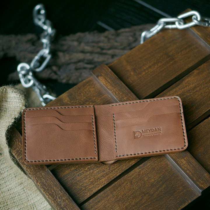 Handmade bifold wallet hand stitched with vegtan leather