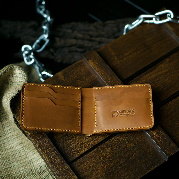 Handmade bifold wallet hand stitched with vegtan leather