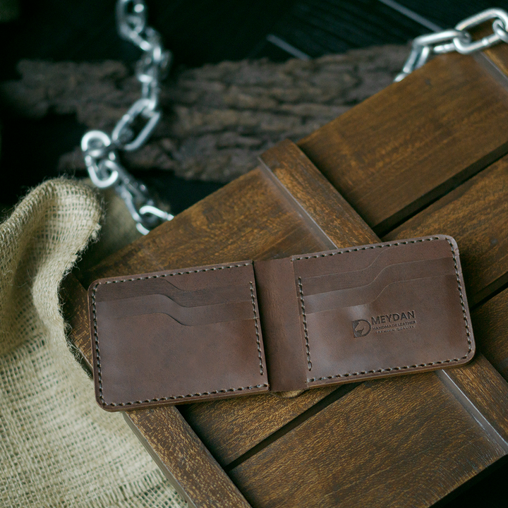 Handmade bifold wallet hand stitched with vegtan leather