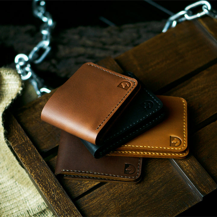 Handmade bifold wallet hand stitched with vegtan leather