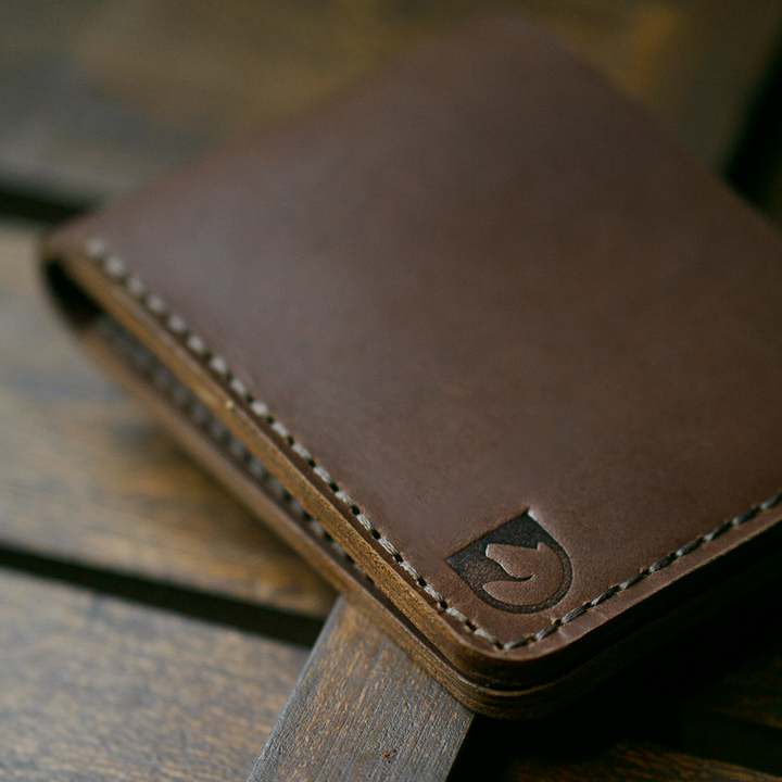 Handmade bifold wallet hand stitched with vegtan leather