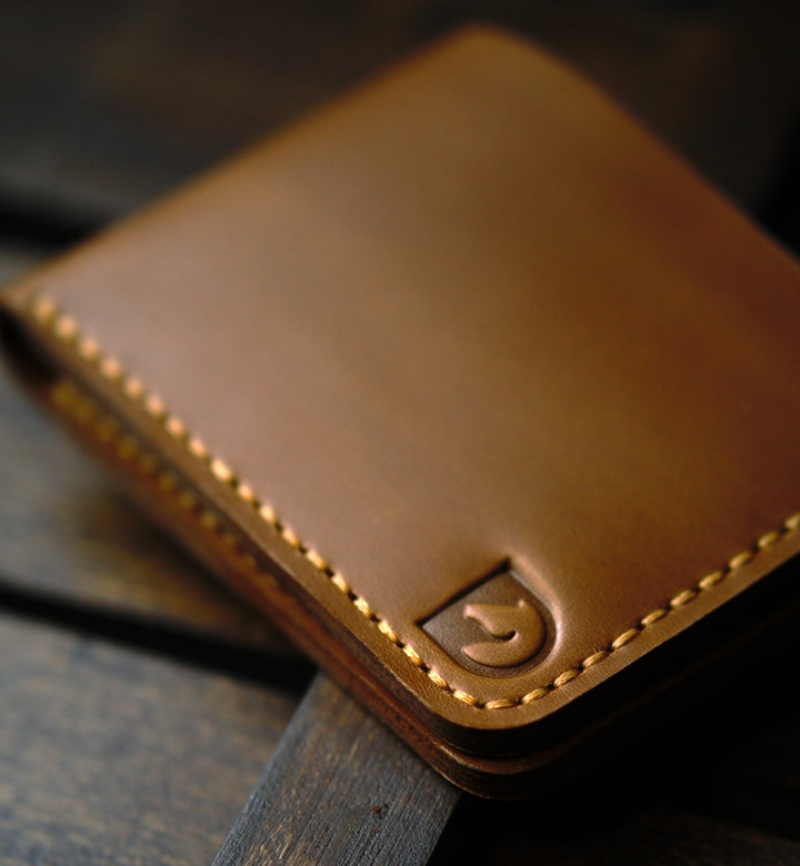 Handmade bifold wallet hand stitched with vegtan leather