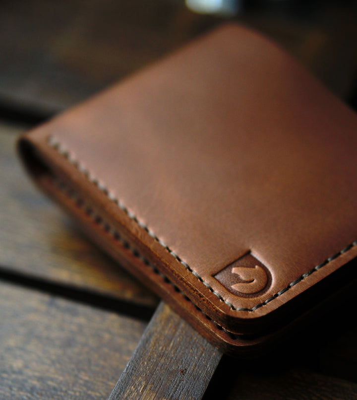 Handmade bifold wallet hand stitched with vegtan leather